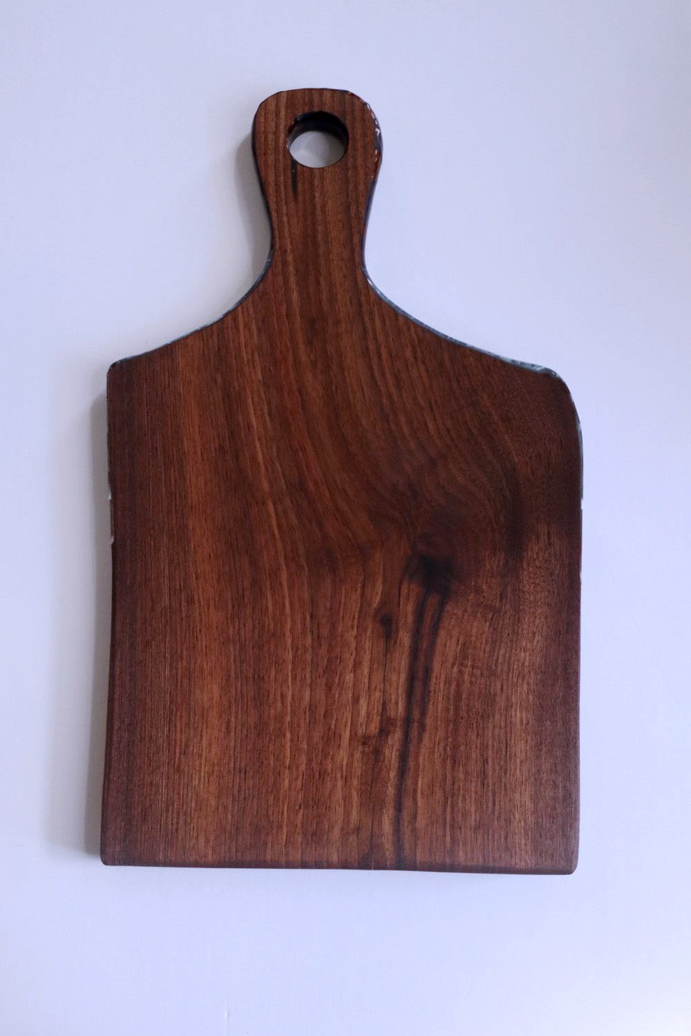 Food-safe ocean resin cutting board with natural wood grain detail